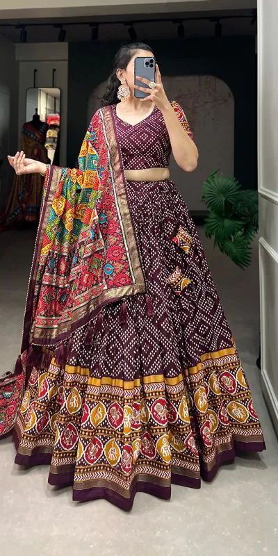 Angelic Wine Color Tussar Silk With Heavy Tassels patola printed Lehenga Choli