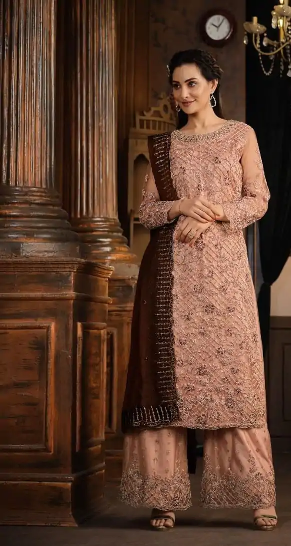 Superb Onion Heavy Net Coding Sequence Embroidery Salwar Suit